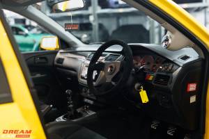 Win this Wasp Yellow Mitsubishi Evo 9 & £1,000