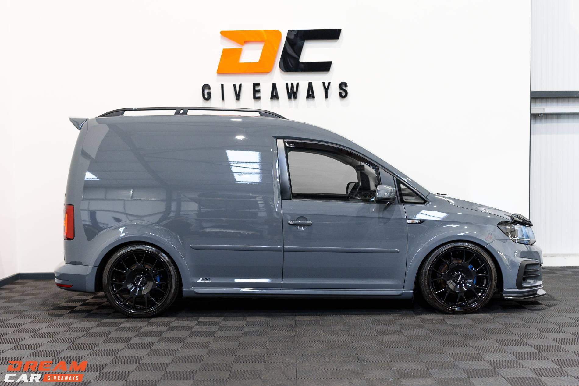 Win this Pure Grey Volkswagen Caddy & £2,000