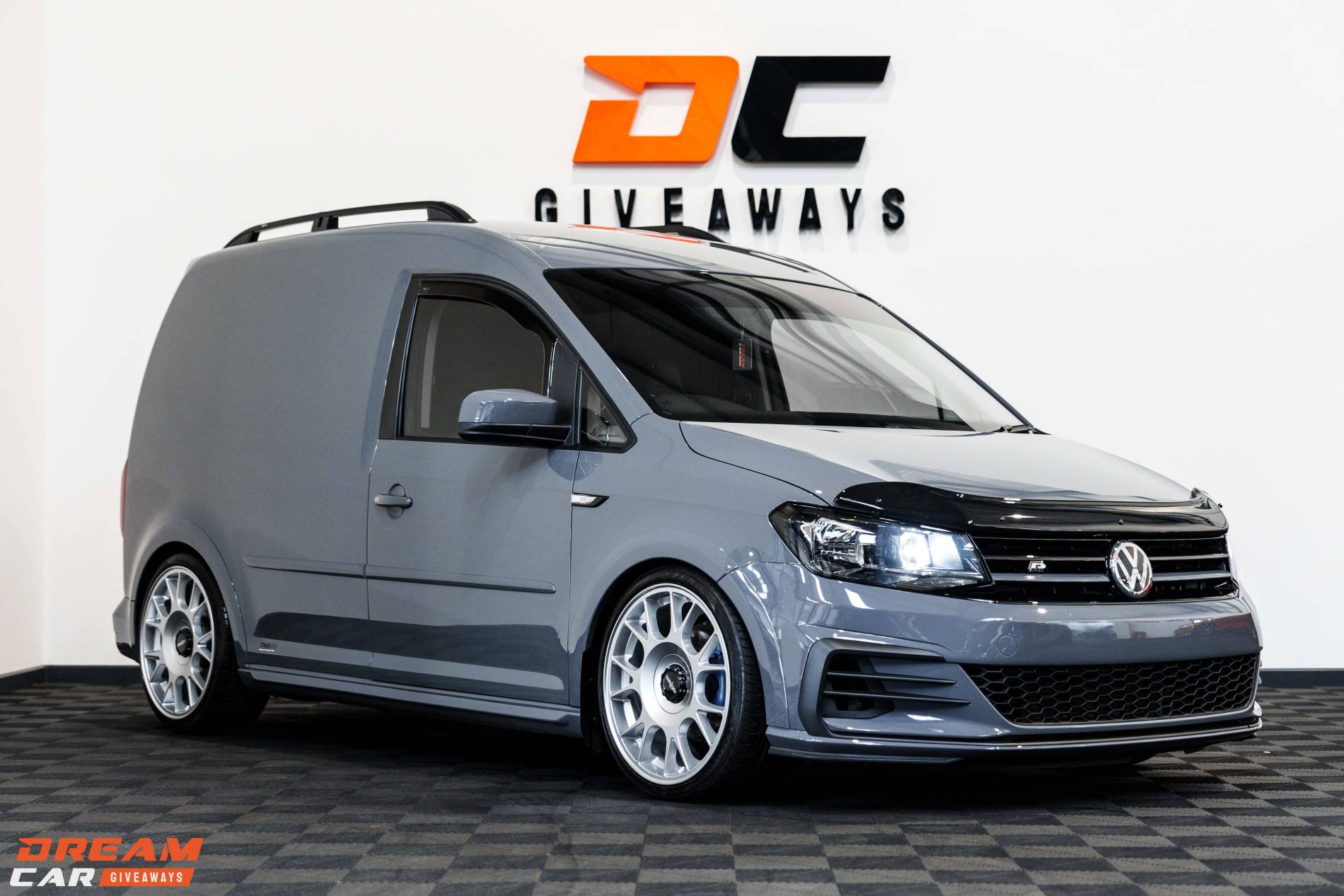 Win this Pure Grey Volkswagen Caddy & £5,000 Tax Free